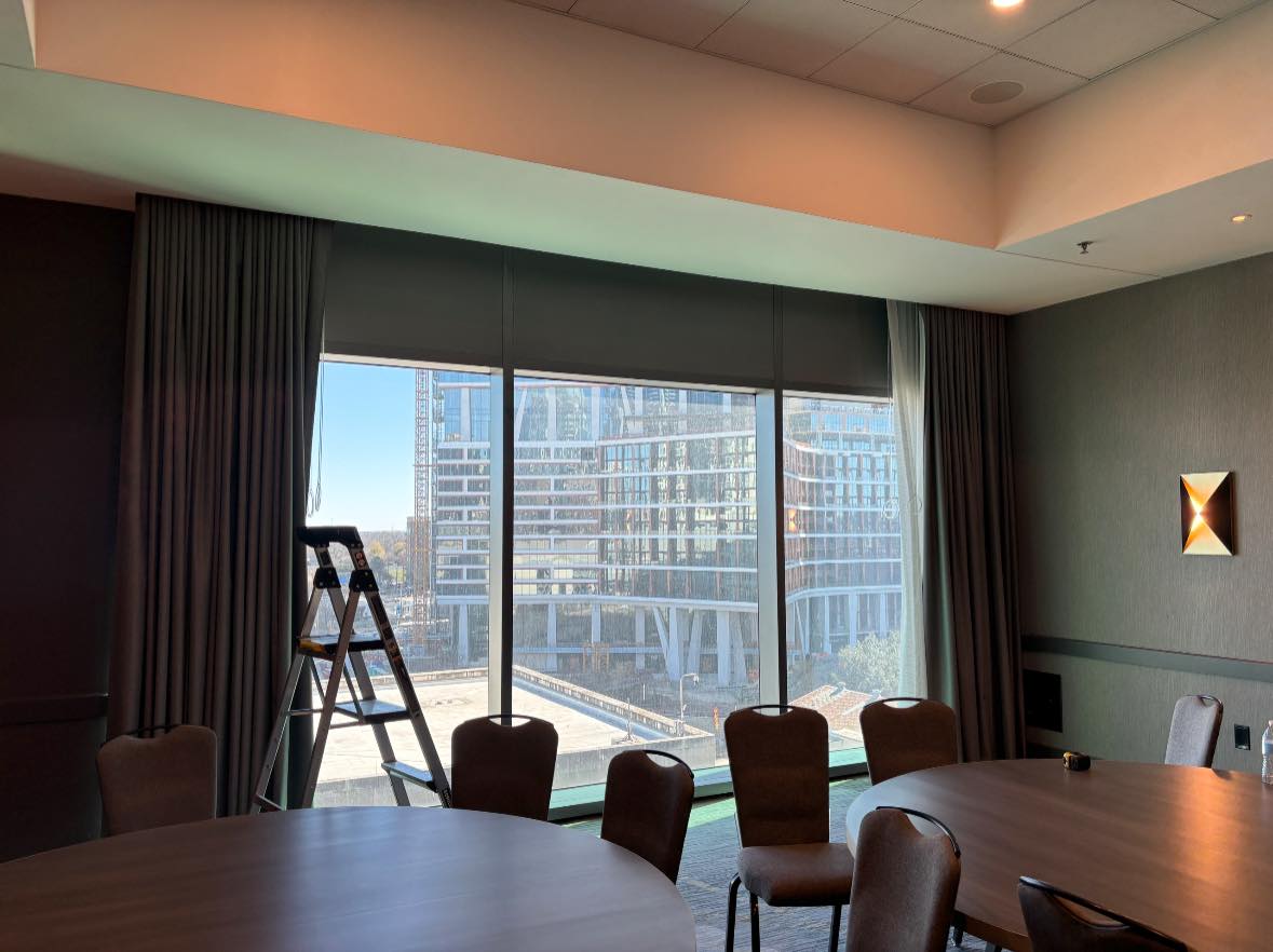 Photo of installed soundproof window inserts on a tall window.