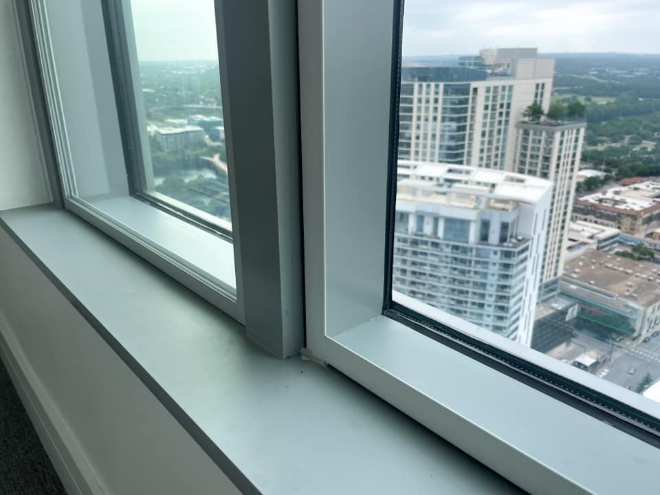 Installed (left) vs not installed (right) Close-up showing a window with an installed soundproof window insert on the left, and none on the right.